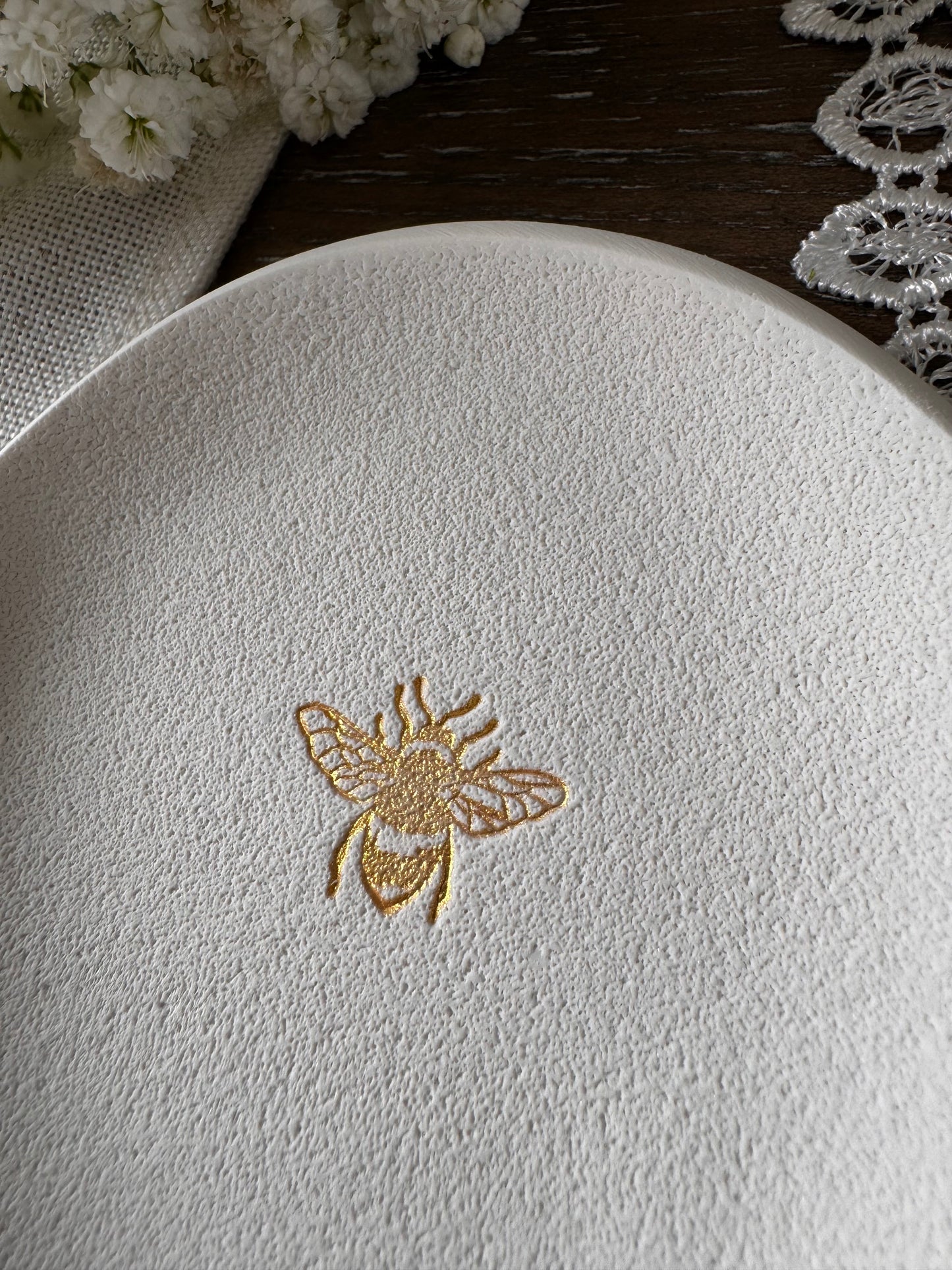 ring dish with bumble bee in gold