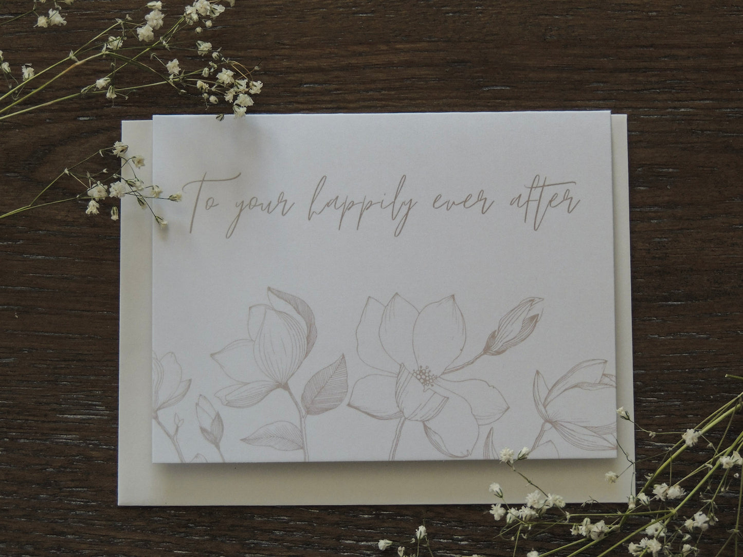card with simple florals and the words "to your happily ever after" on front