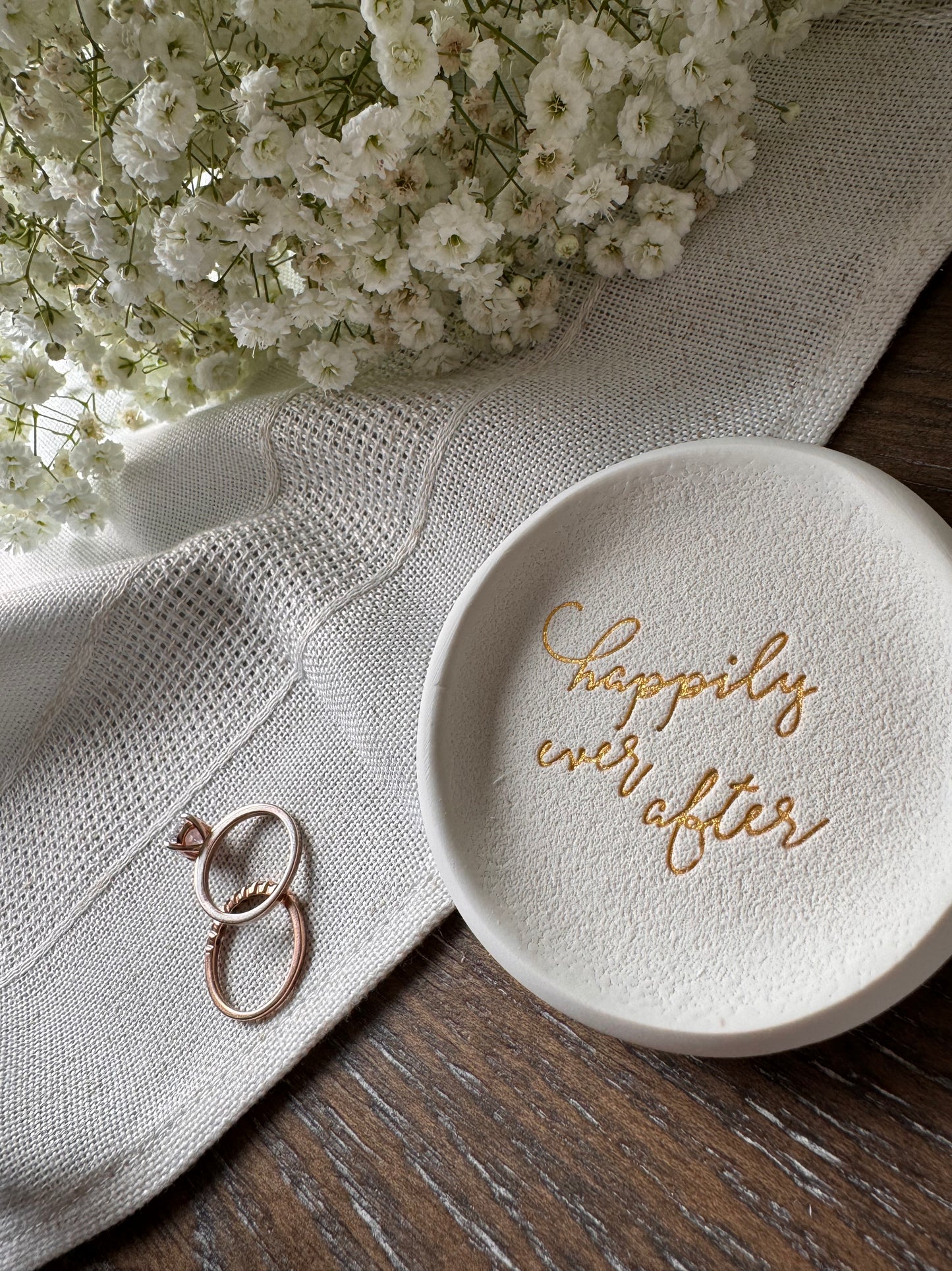 ring dish with happily ever after phrase in gold