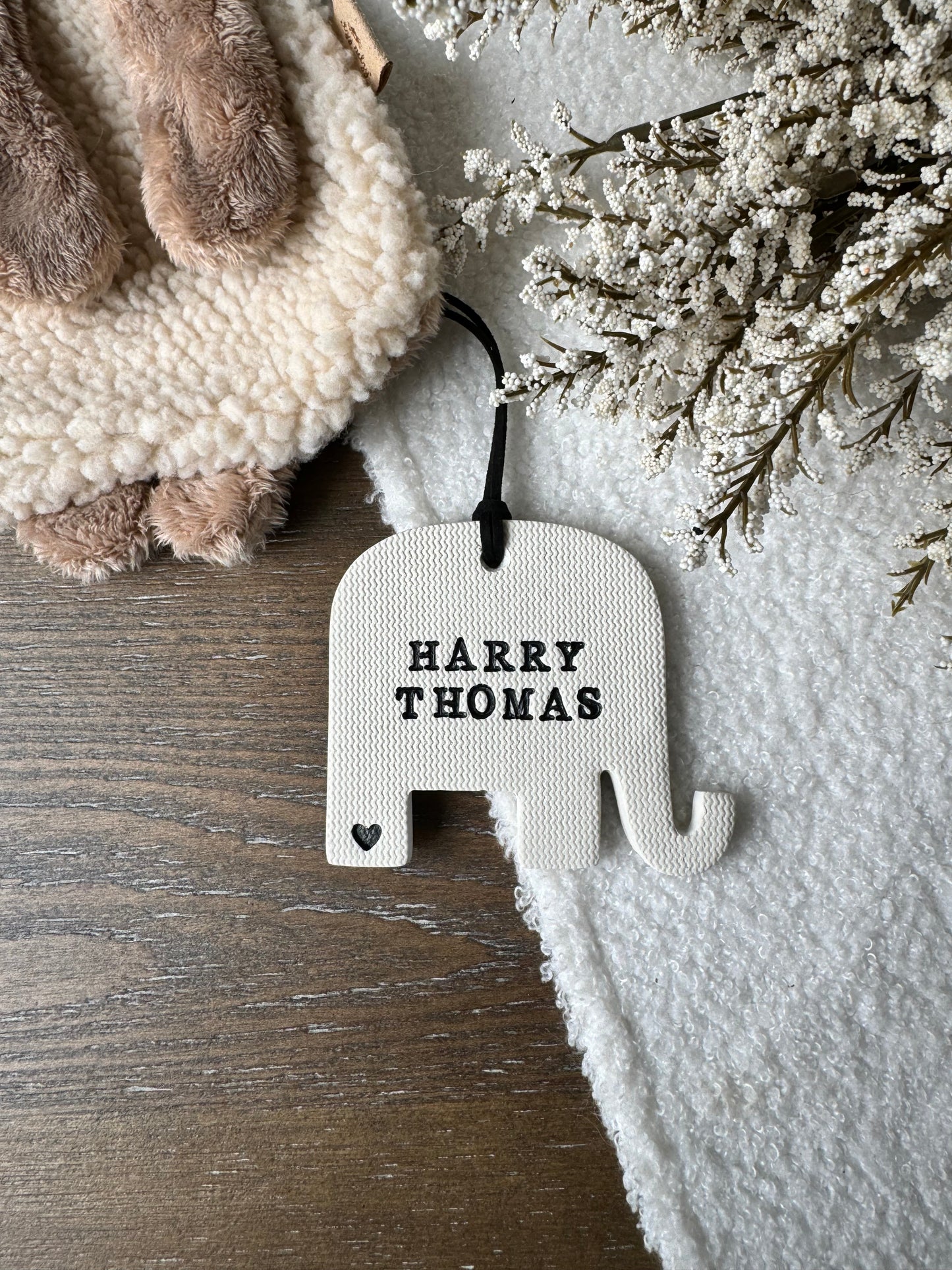 elephant shaped white clay ornament with personalized baby name