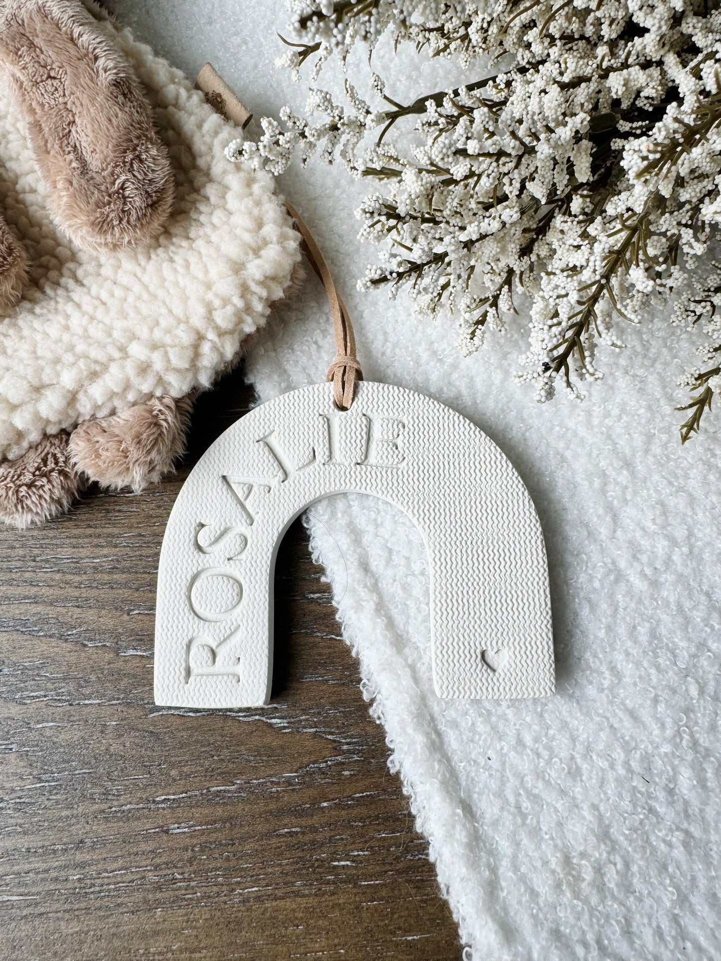 white clay rainbow shaped ornament with embossed name, perfect for baby gift, personalized name
