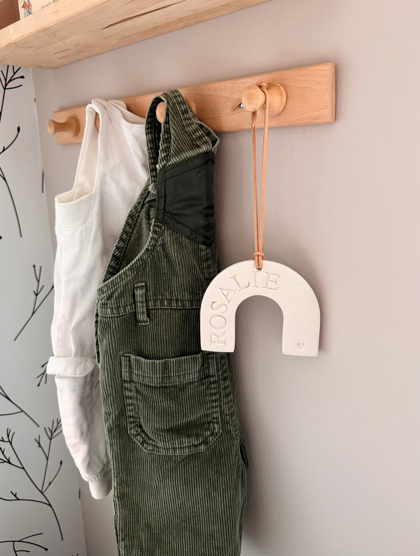 custom white clay rainbow shaped ornament with embossed name, perfect for baby gift