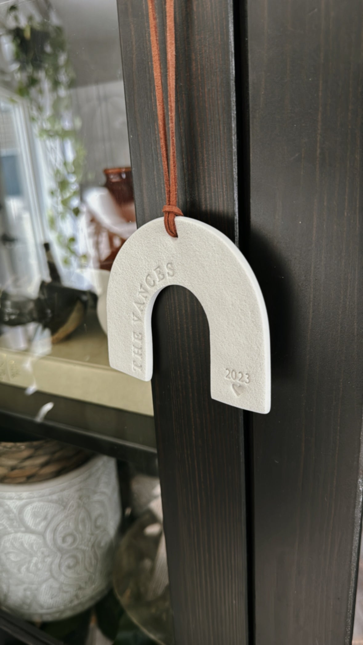 rainbow shaped ornament with family name and date