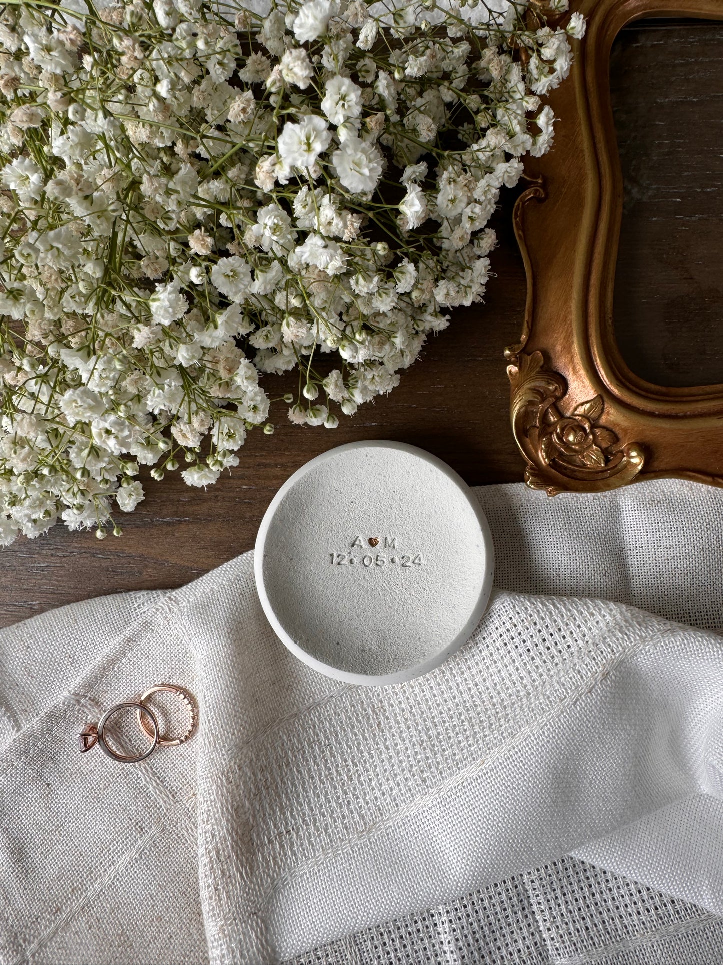 ring dish made of white clay with simple embossed initials and wedding date, perfect couples gift