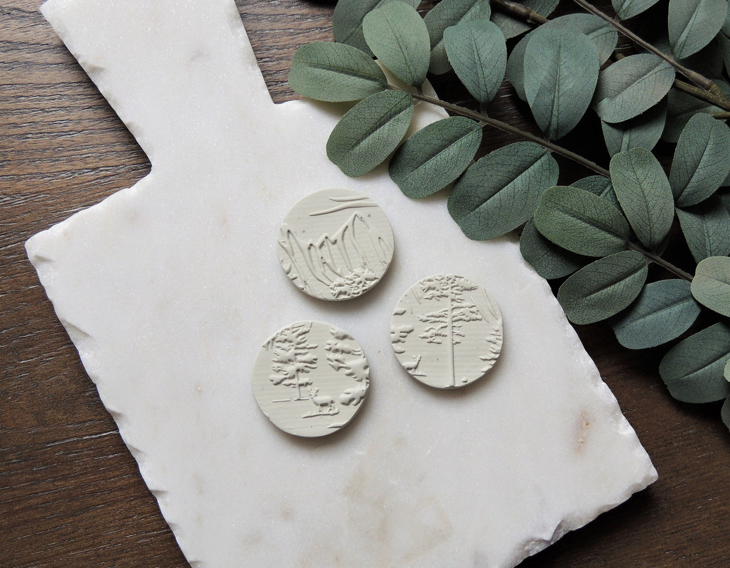 round magnets with abstract tree design, white