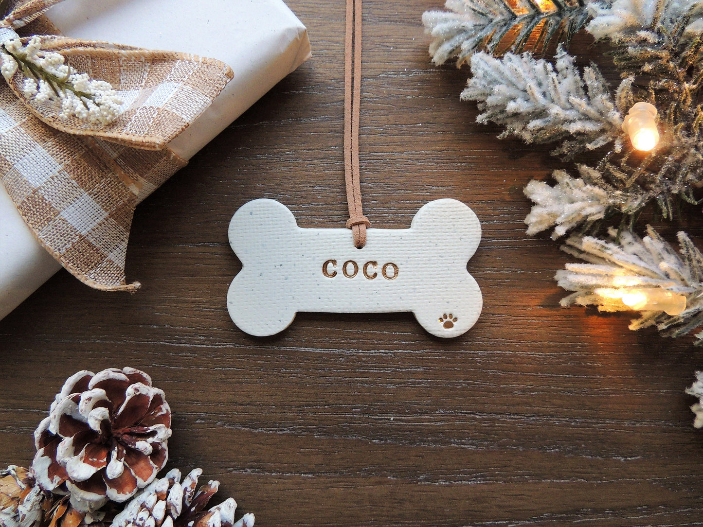 custom bone shaped ornament for pet with name and paw print, white and gold