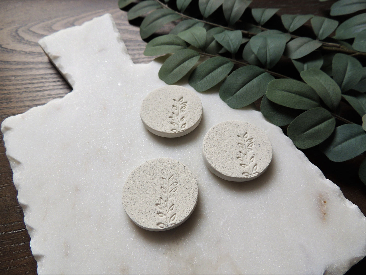 ivory magnets with embossed botanical design, simple