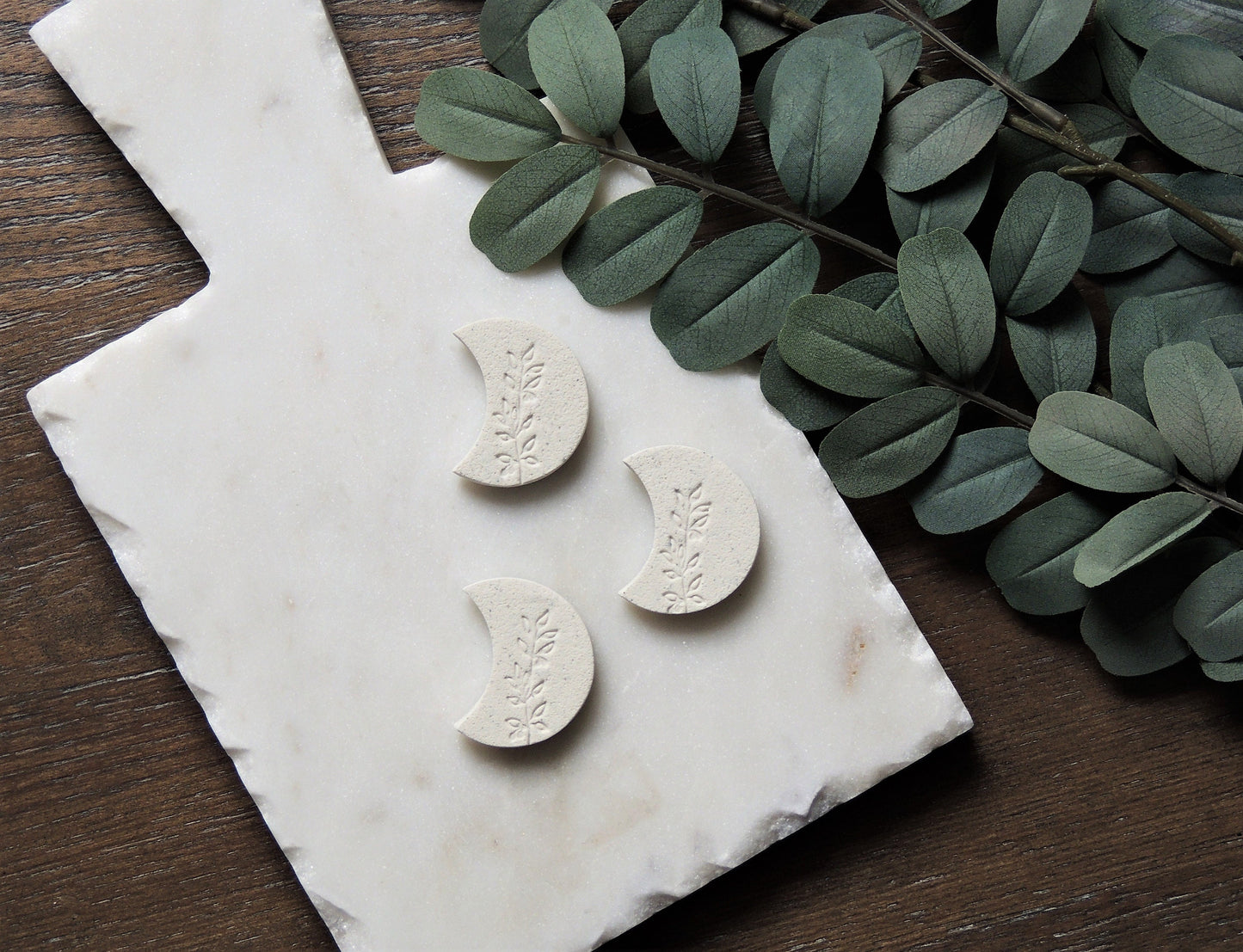 crescent moon white magnet with olive leaf design