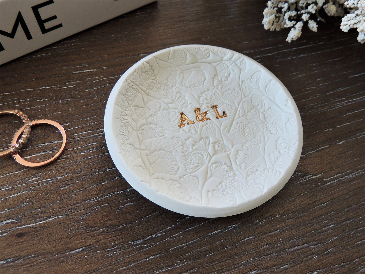 Ring dish with personalized gold foil initials in the center and floral lace pattern