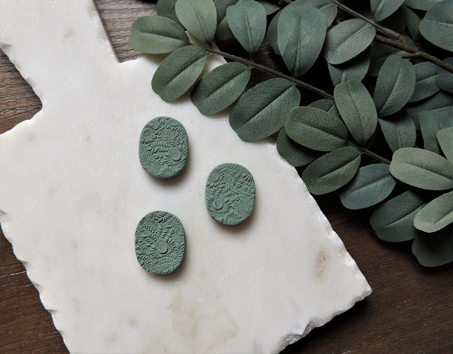 set of three magnets with floral pattern in cool green