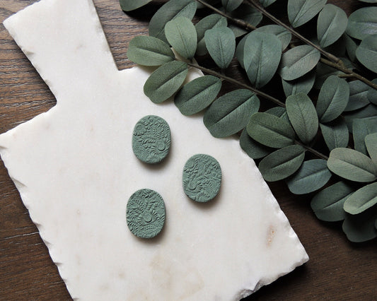 set of three magnets with floral pattern in cool green