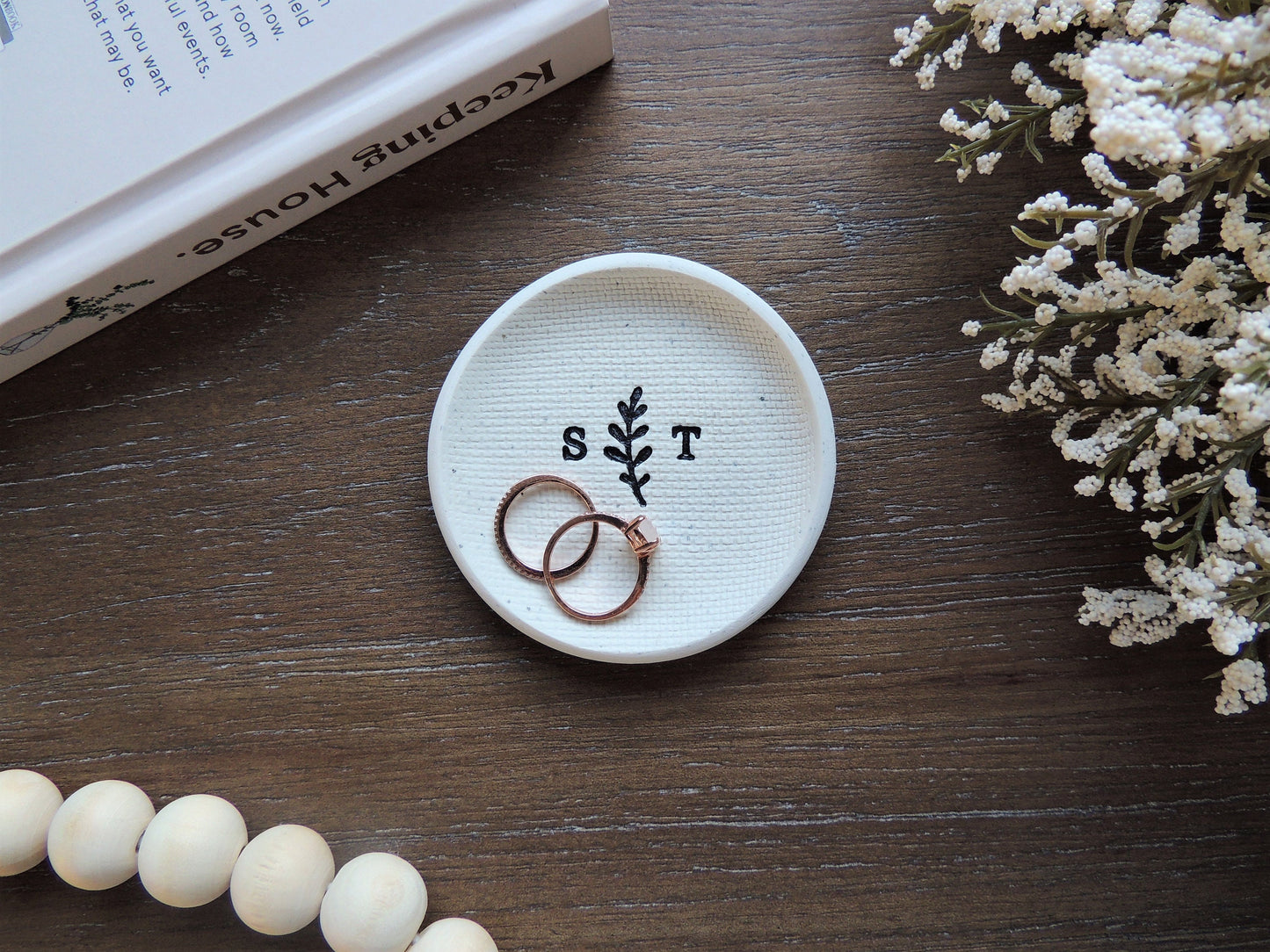 white clay ring dish with simple black initials and olive branch leaf, wedding couple gift