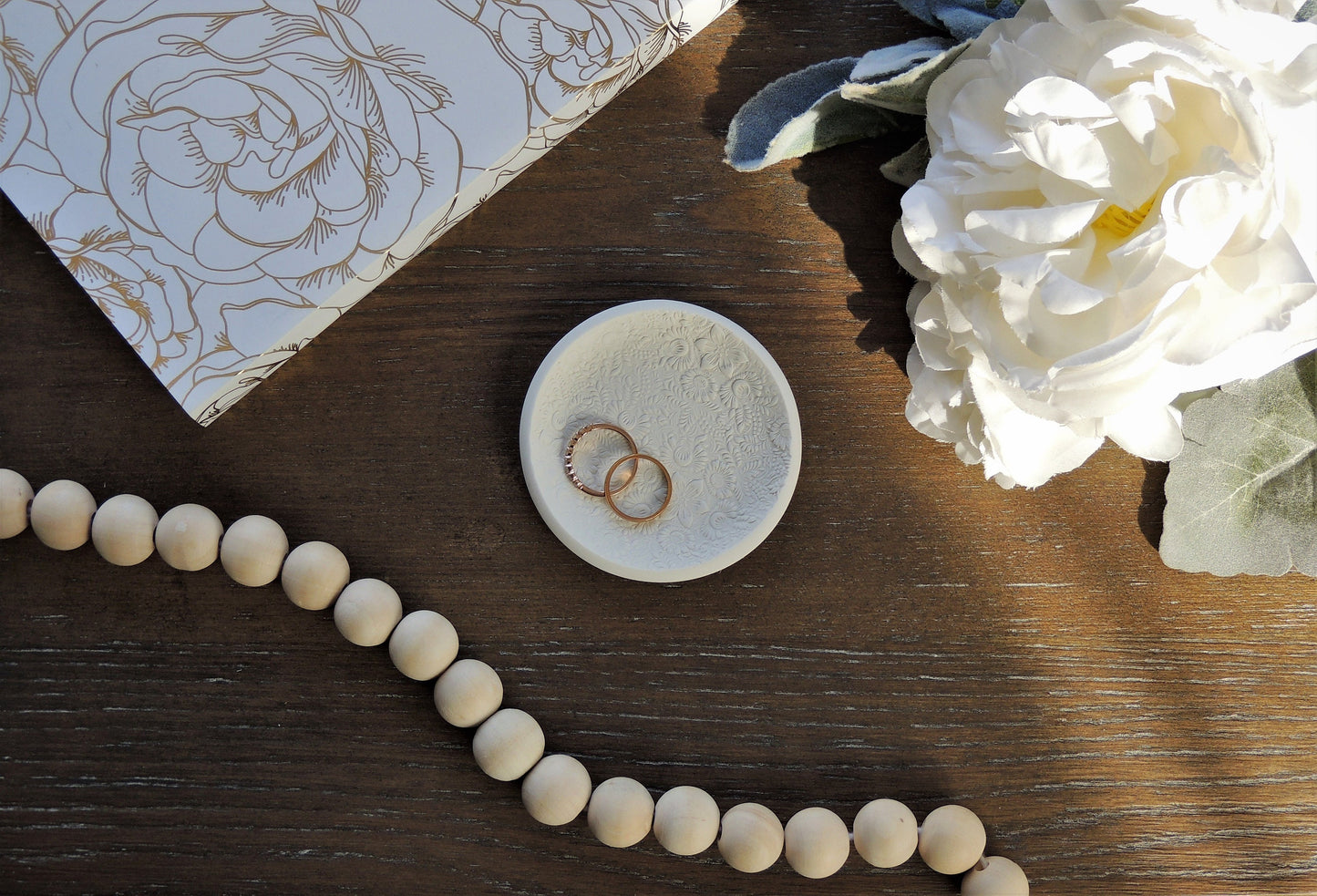 white ring dish with sunflower print