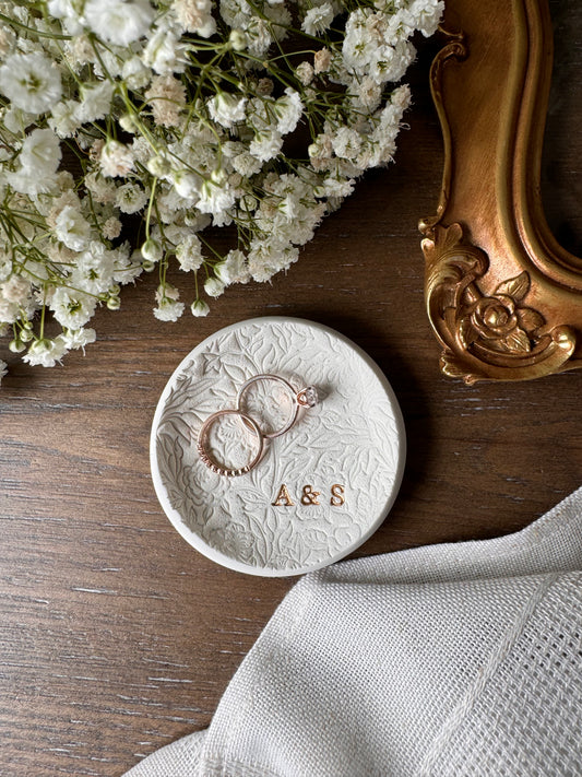 floral textured design ring dish made of white clay with initials in bottom right of dish