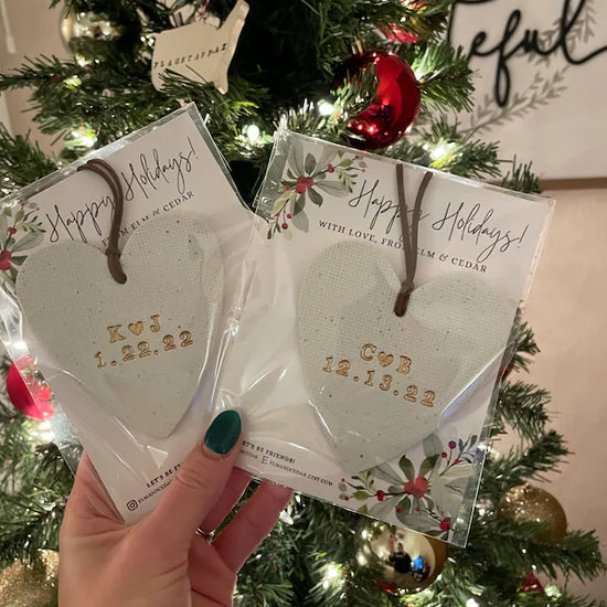 Holiday heart shaped ornaments with couples initials and wedding dates 