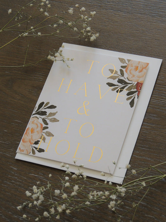 card for couples wedding with phrase 'to have and to hold' on front with floral design and gold foil