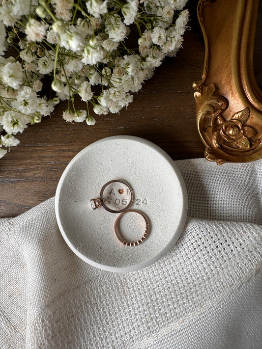 ring dish made of white clay with simple embossed initials and wedding date, perfect couples gift