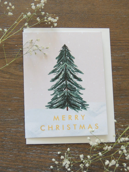 Christmas card with tree and gold words 'Merry Christmas"