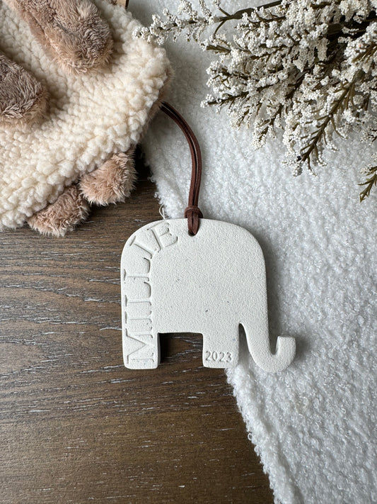 white clay elephant shaped ornament with embossed name, perfect for baby gift