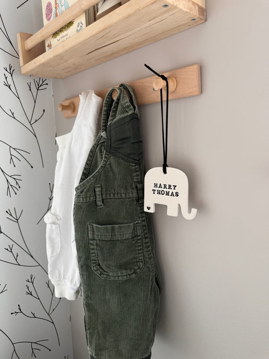 elephant shaped white clay ornament with personalized baby name