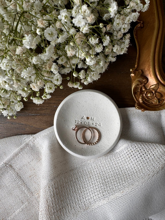 ring dish made of white clay with simple embossed initials and wedding date, perfect couples gift