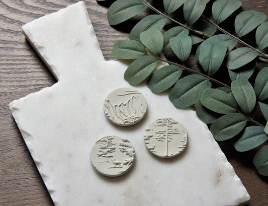 round magnets with abstract tree design, white