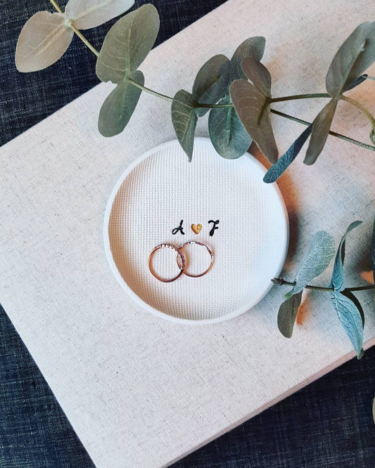 ring dish with black and gold writing in center made of white clay, gift for couples