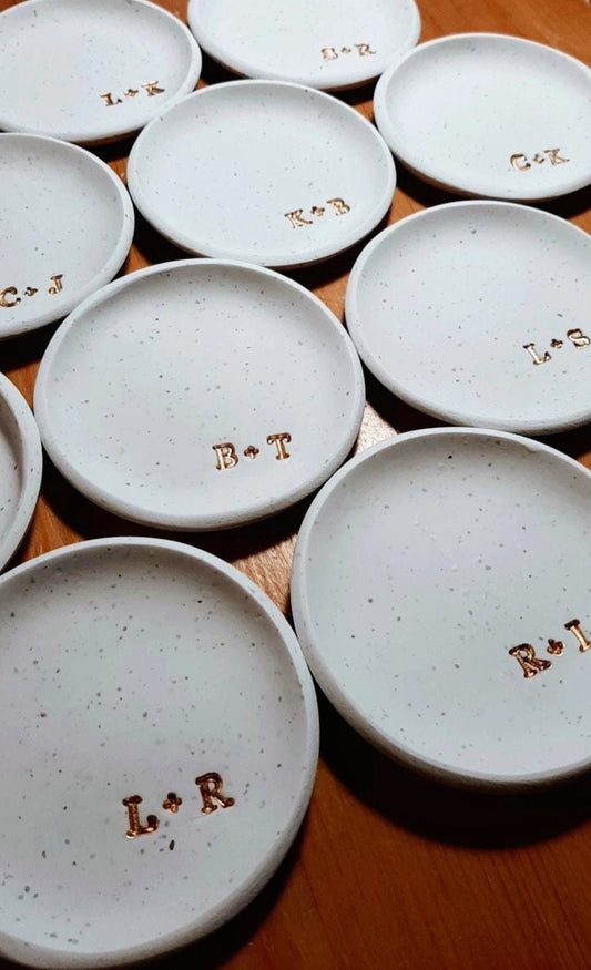 grouping of white speckled rings dishes with couples initials in gold, perfect wedding gift