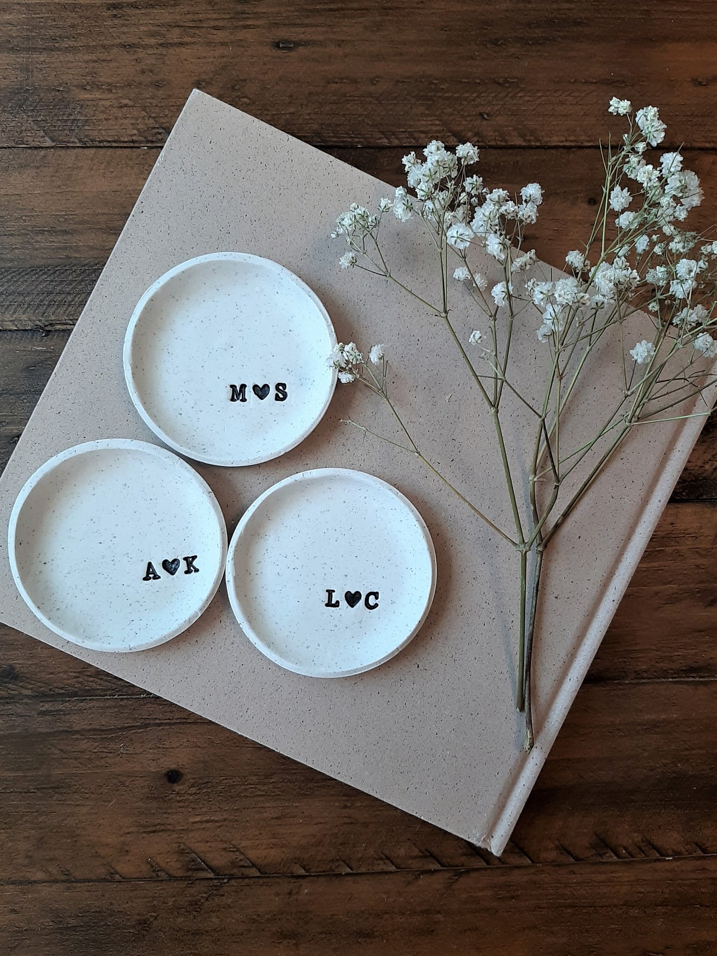three custom ring dishes with couple's initials for wedding gift