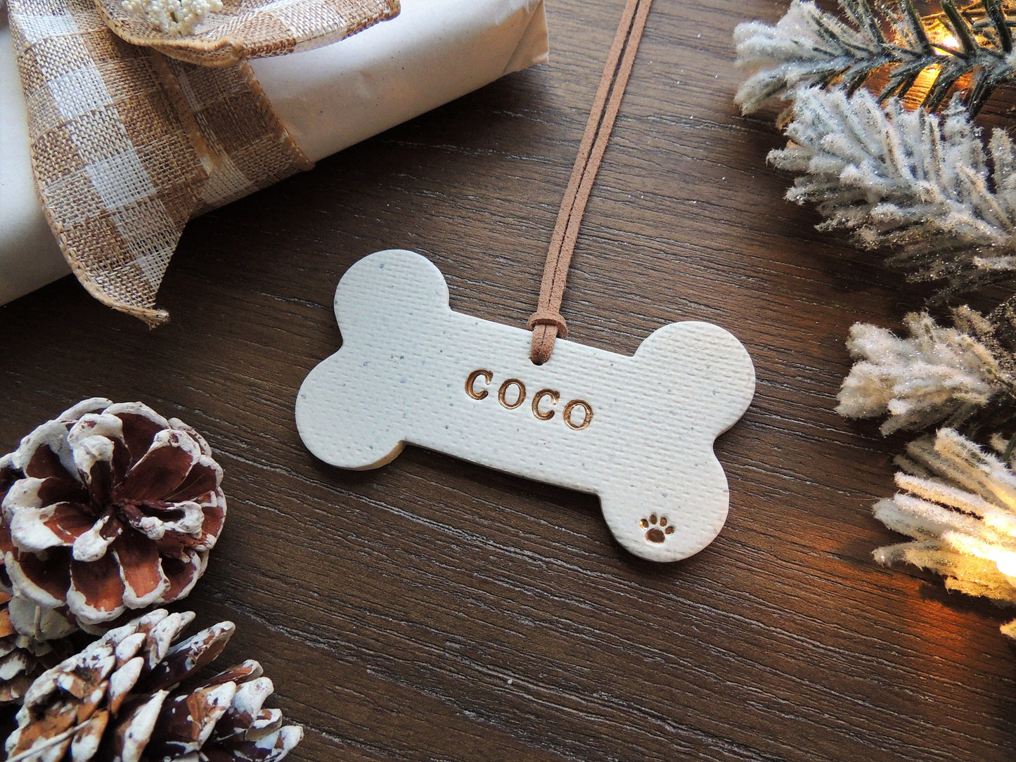 white dog bone ornament personalized with name and paw print