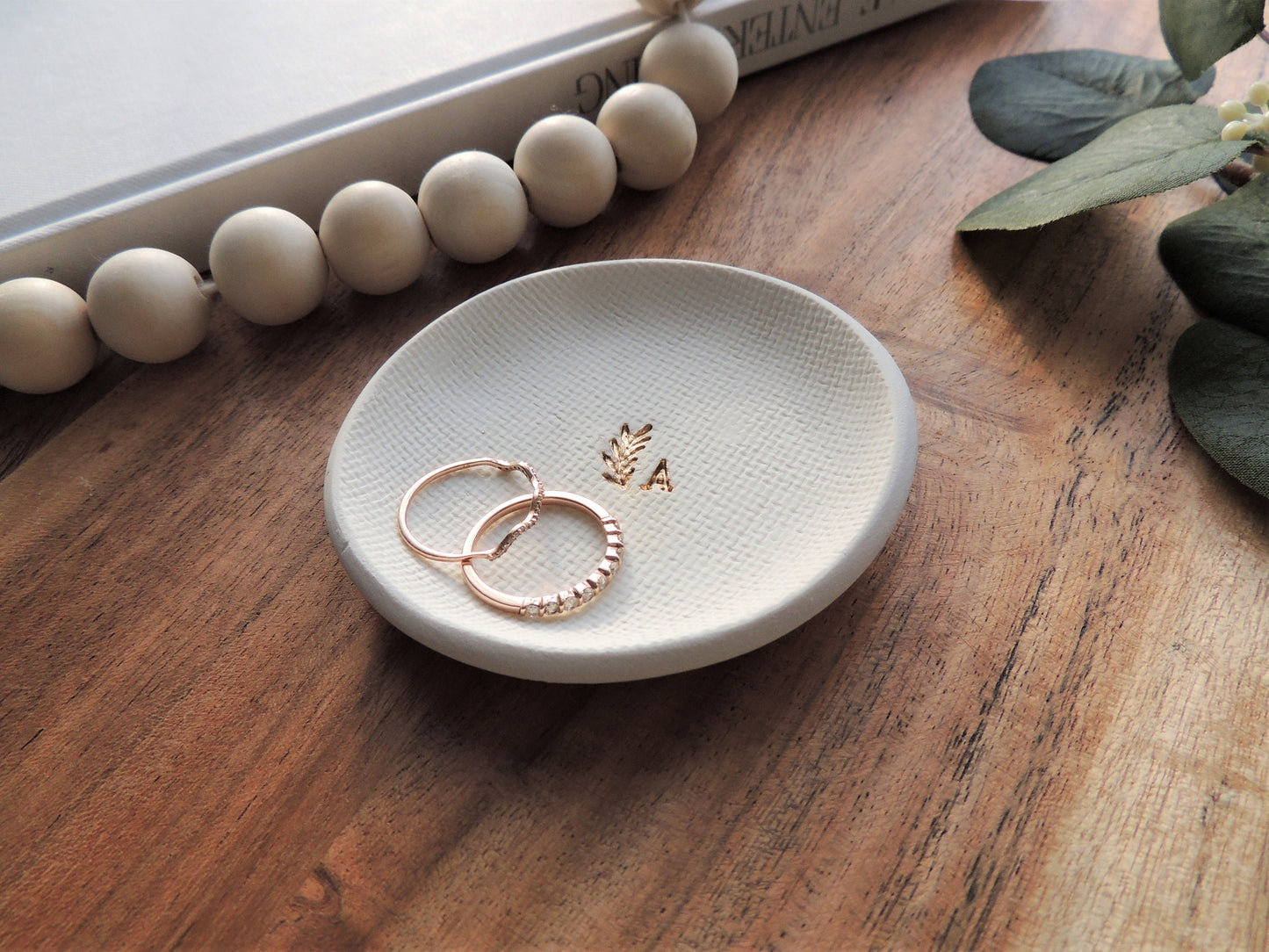 white clay ring dish with gold foil initial and small leaf design, very simple, gift for her