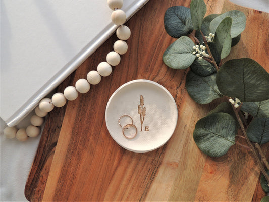 white clay ring dish with gold embossed wheat design and personalized initial