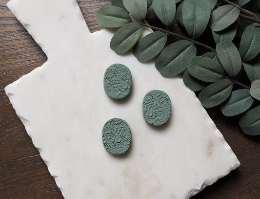 set of three magnets with floral pattern in cool green