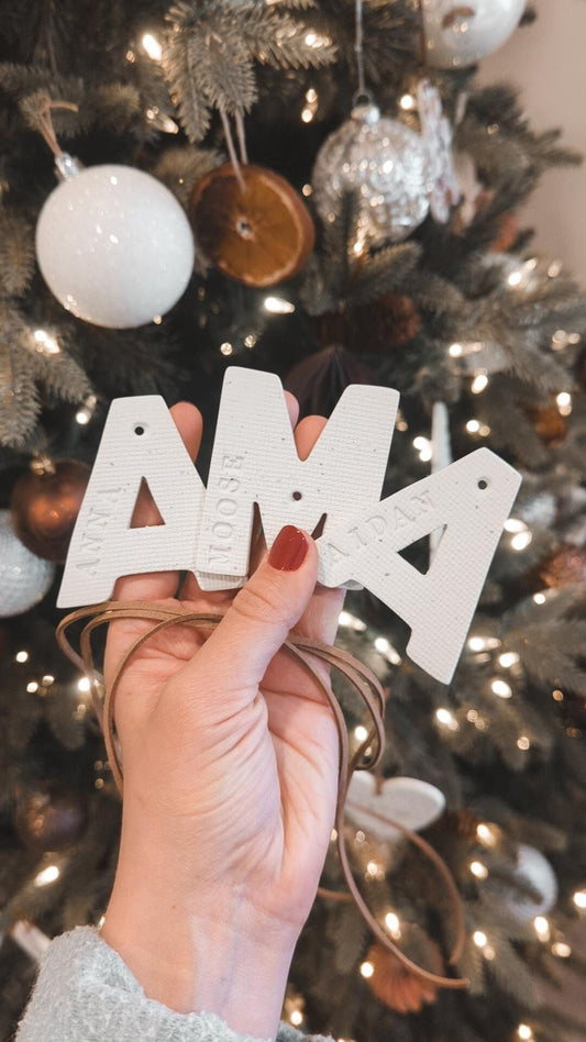 letter shaped ornaments with names embossed on sides