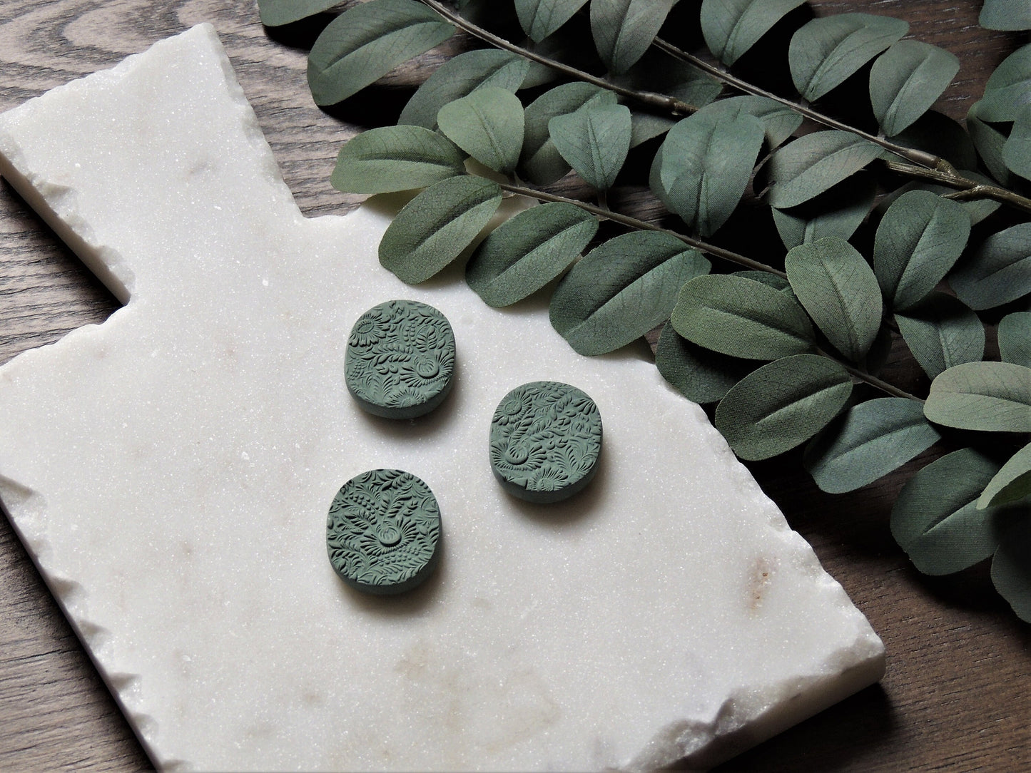 set of three magnets with floral pattern in cool green