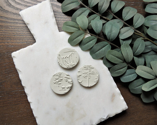 round magnets with abstract tree design, white