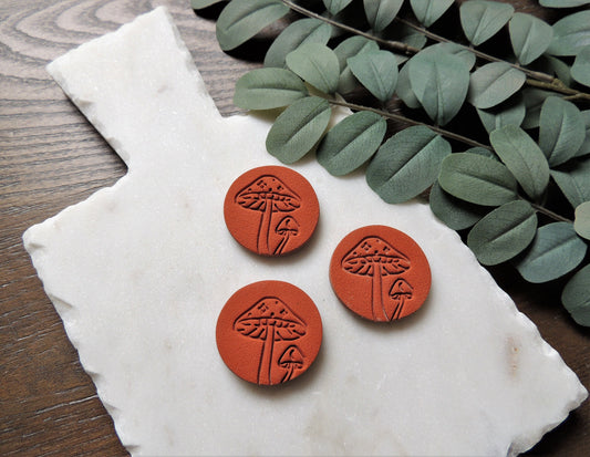 terracotta colored magnets with embossed mushroom design for house warming gift