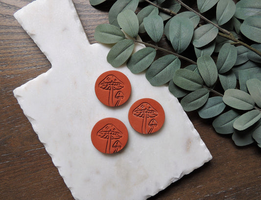 terracotta colored magnets with embossed mushroom design for house warming gift
