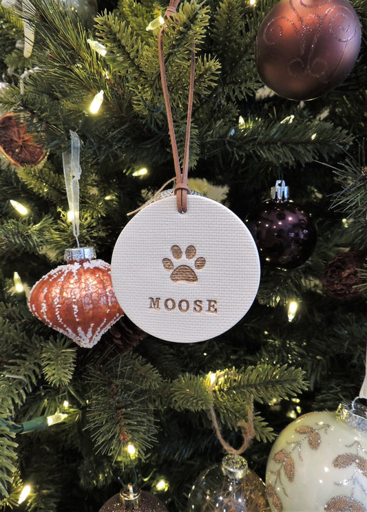 pet ornament with large paw print and name