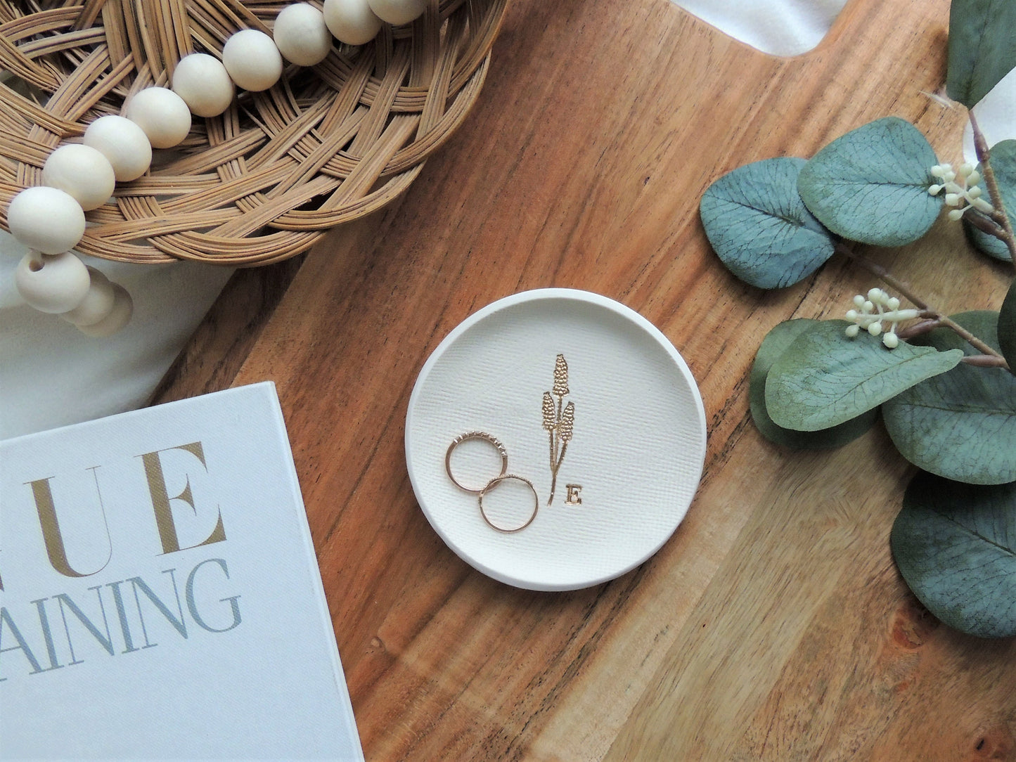 white clay ring dish with gold embossed wheat design and personalized initial