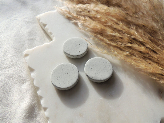 simple circular speckle clay magnets in white