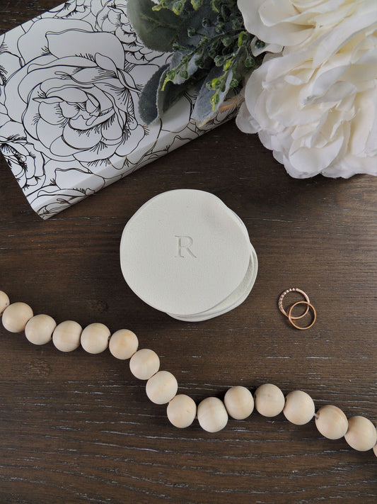 simple single letter ring dish with wavy natural edges