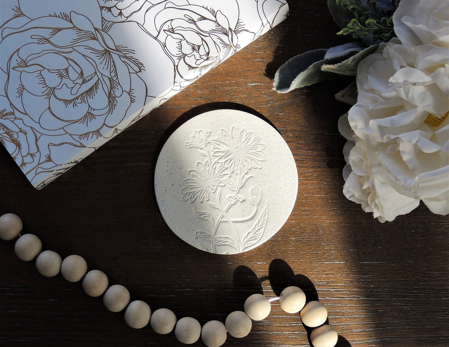 coaster with flower design in white