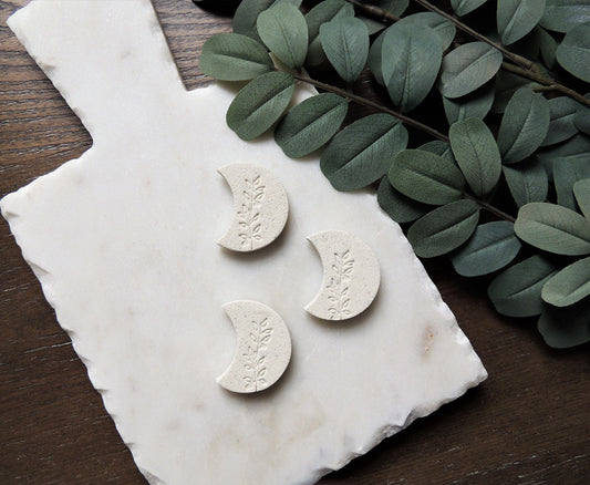 crescent moon white magnet with olive leaf design